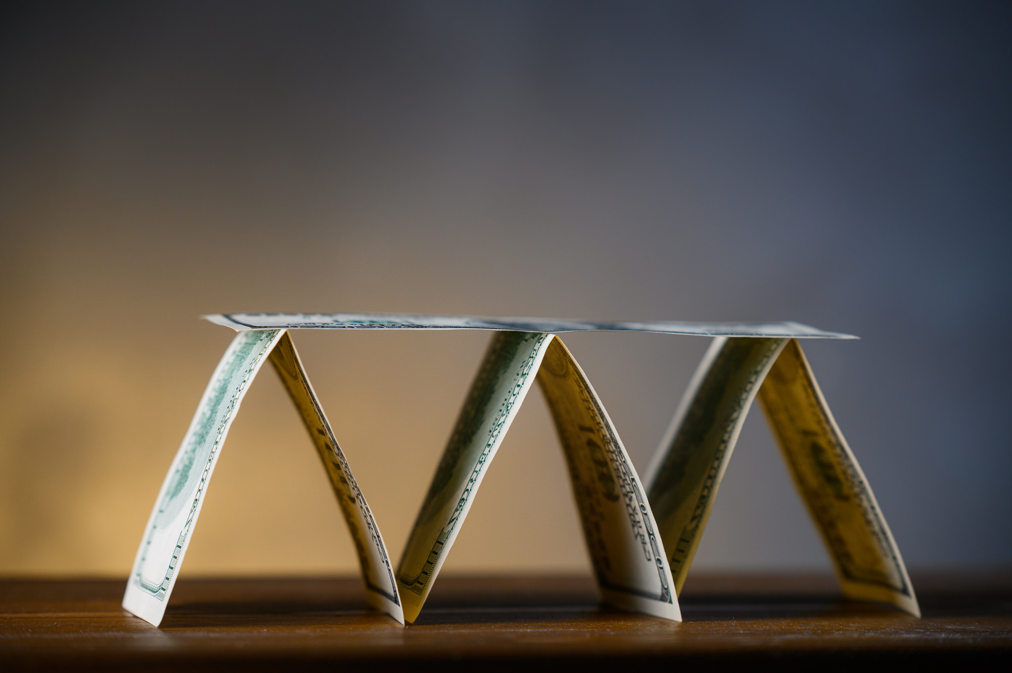 base of pyramid with dollar bills