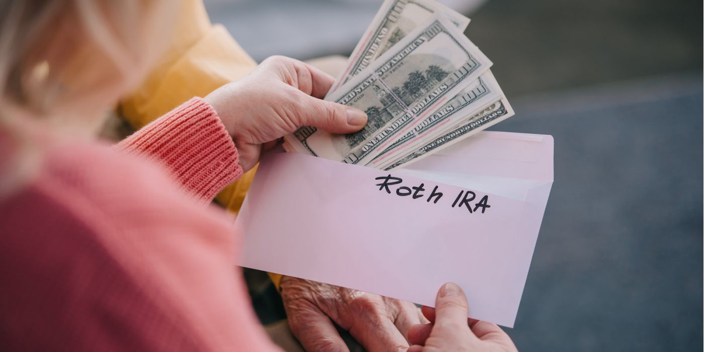 Woman opening envelope